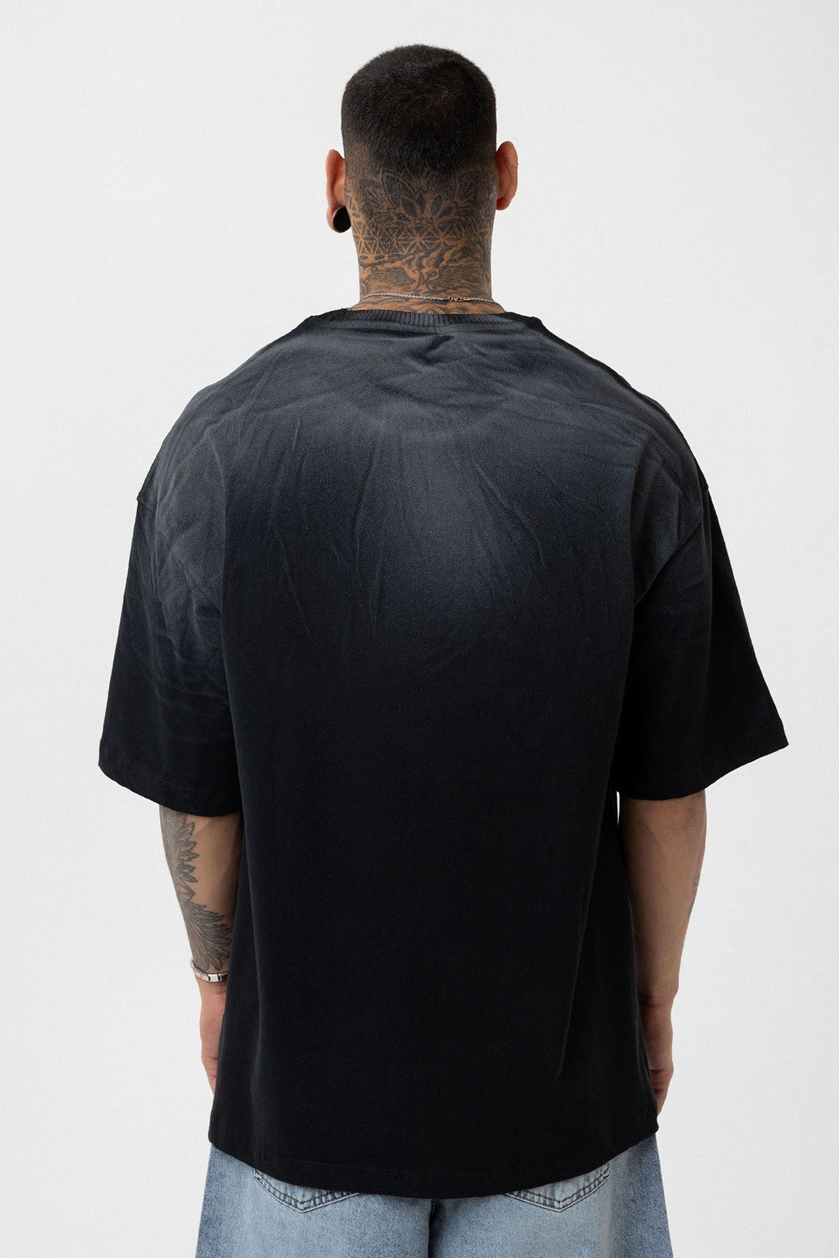 Oversized T-Shirt with Washed-Out Print and Detailed Design